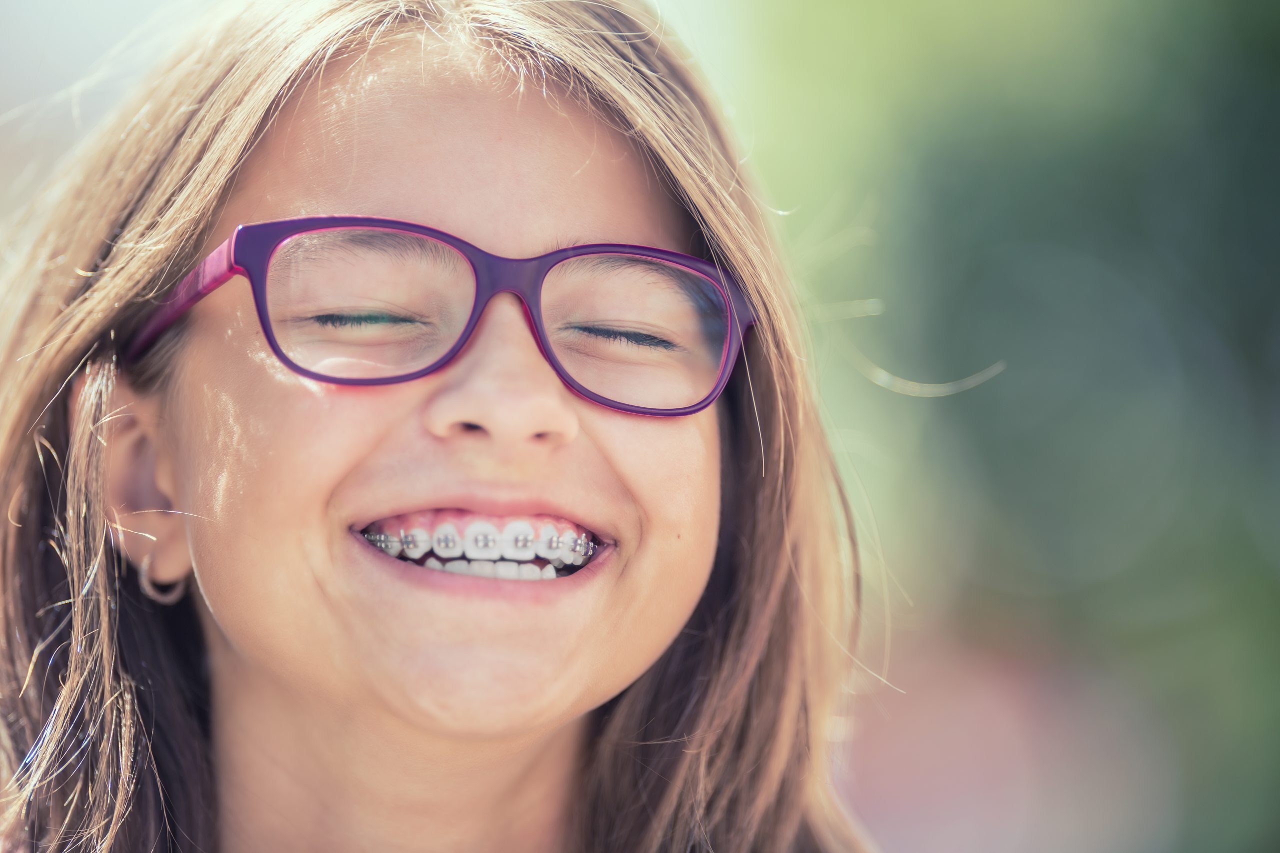 Child smiling with braces at Viva Orthodontics in Waterdown